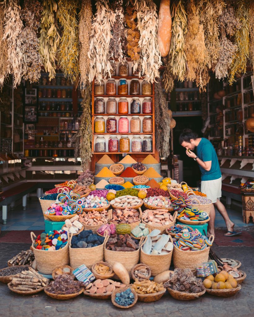 pexels-photo-3889827-3889827 Vibrant display of spices and goods in a Marrakesh street market showcasing Moroccan culture.